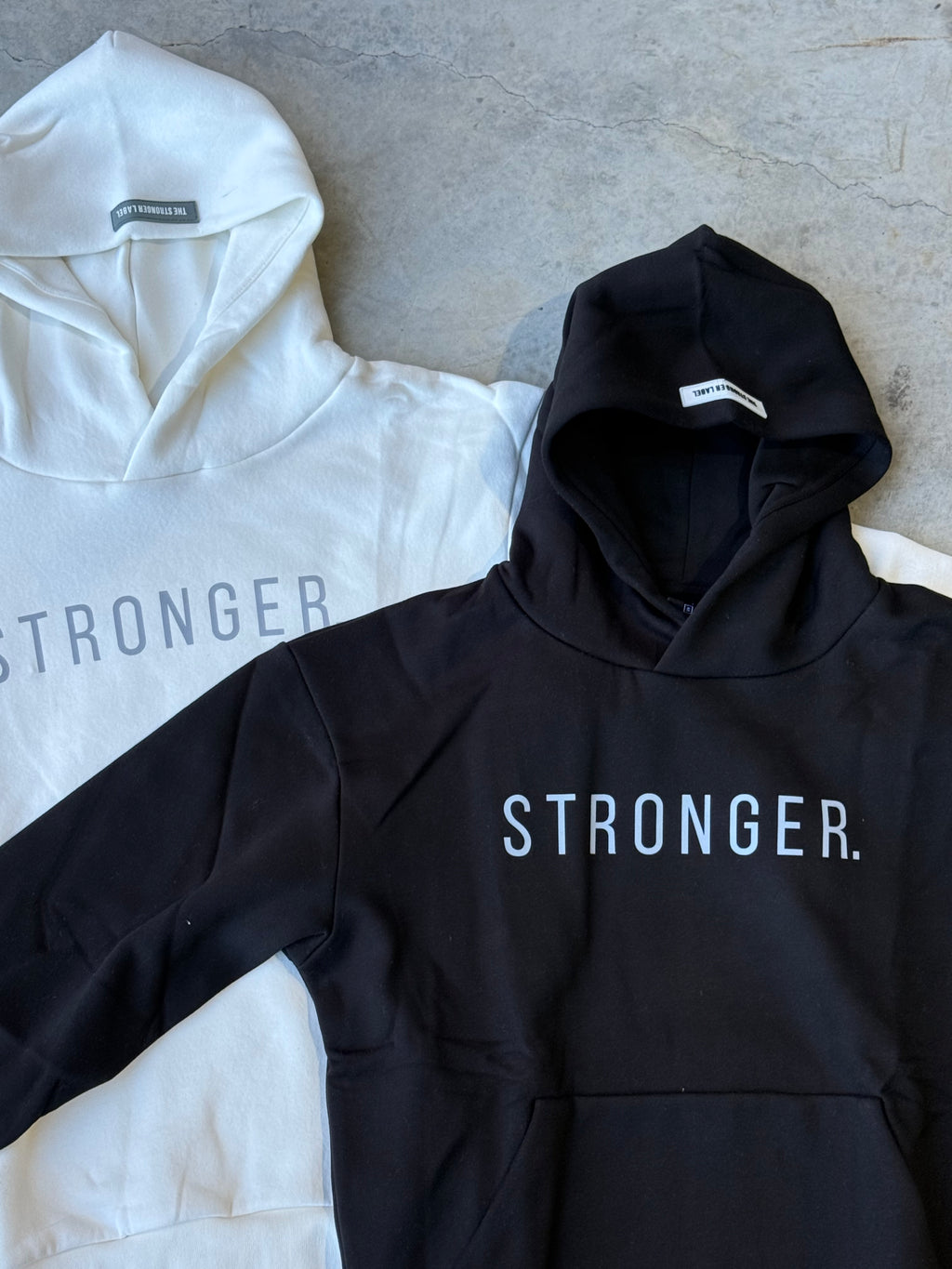 Close Up of Black And White TSL Warm-Up Pump Cover front side, laid flat, side by side – oversized gym long sleeve hoodie teefrom Australian activewear brand
